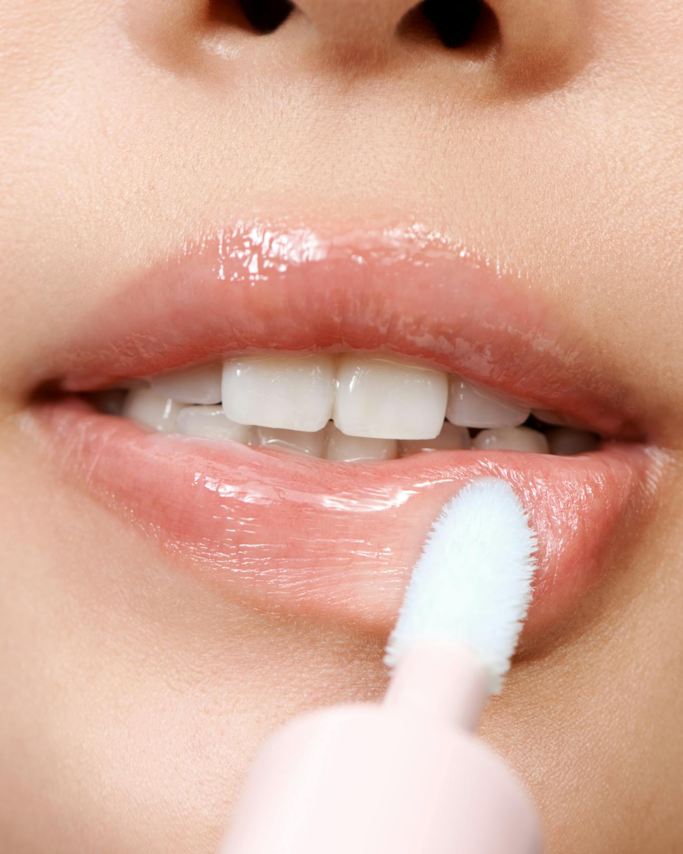 Alison wears Lip Glaze in Icy.